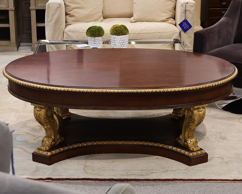 Ornate Oval Mahogany Cocktail Table on Neoclassical Base with Gilded Details