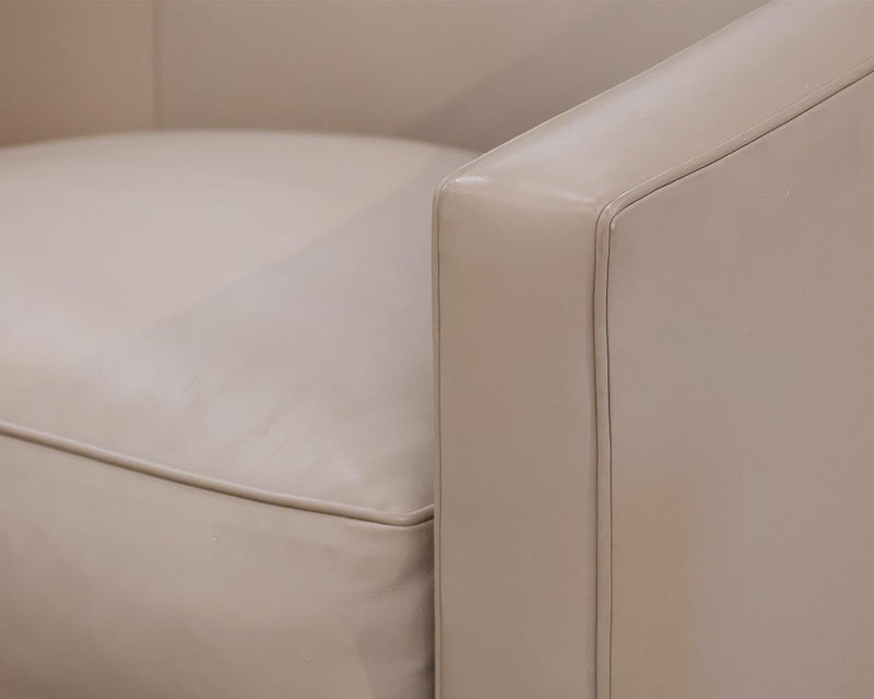 A Rudin Beige Leather Swivel Chair