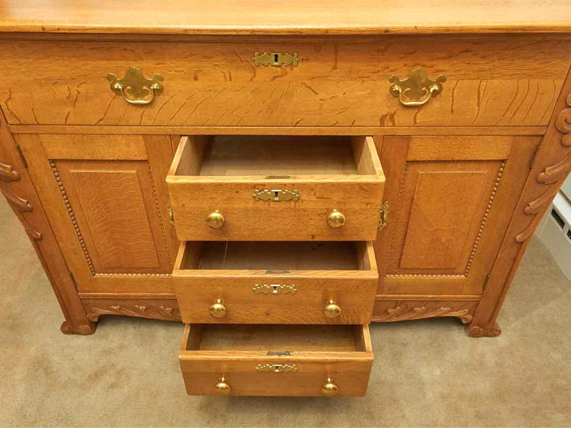 Oak Circa 1880  4 Drawer 2 Door Carved Accents Solid Brass Hardware Sideboard