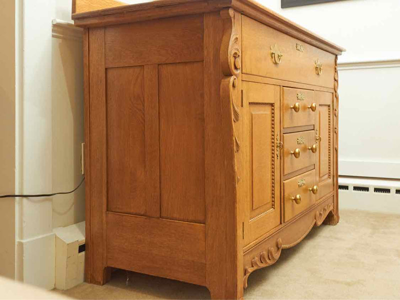 Oak Circa 1880  4 Drawer 2 Door Carved Accents Solid Brass Hardware Sideboard