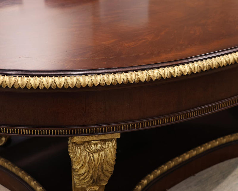 Ornate Oval Mahogany Cocktail Table on Neoclassical Base with Gilded Details