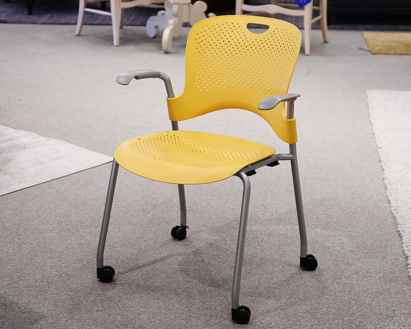 Herman Caper Stacking Chair in Yellow on Casters