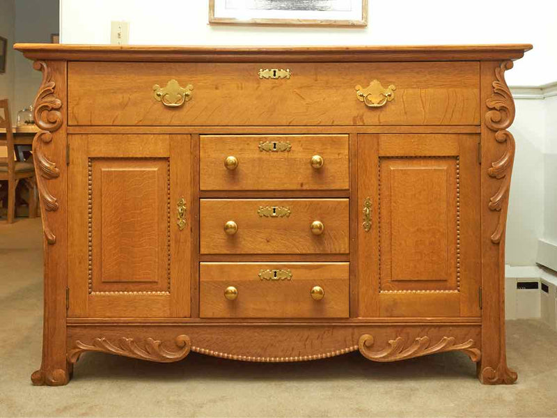 Oak Circa 1880  4 Drawer 2 Door Carved Accents Solid Brass Hardware Sideboard