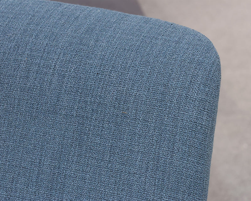 Accent Chairs Contemporary accent chairs in a blue woven fabric.