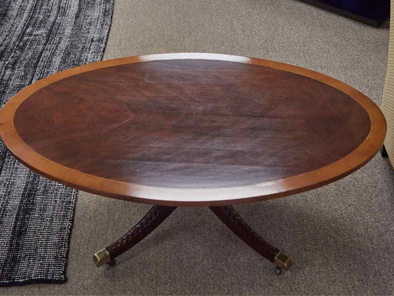 Kindel  Mahogany Pedestal Cocktail Table with Banded Inlay Top & Casters